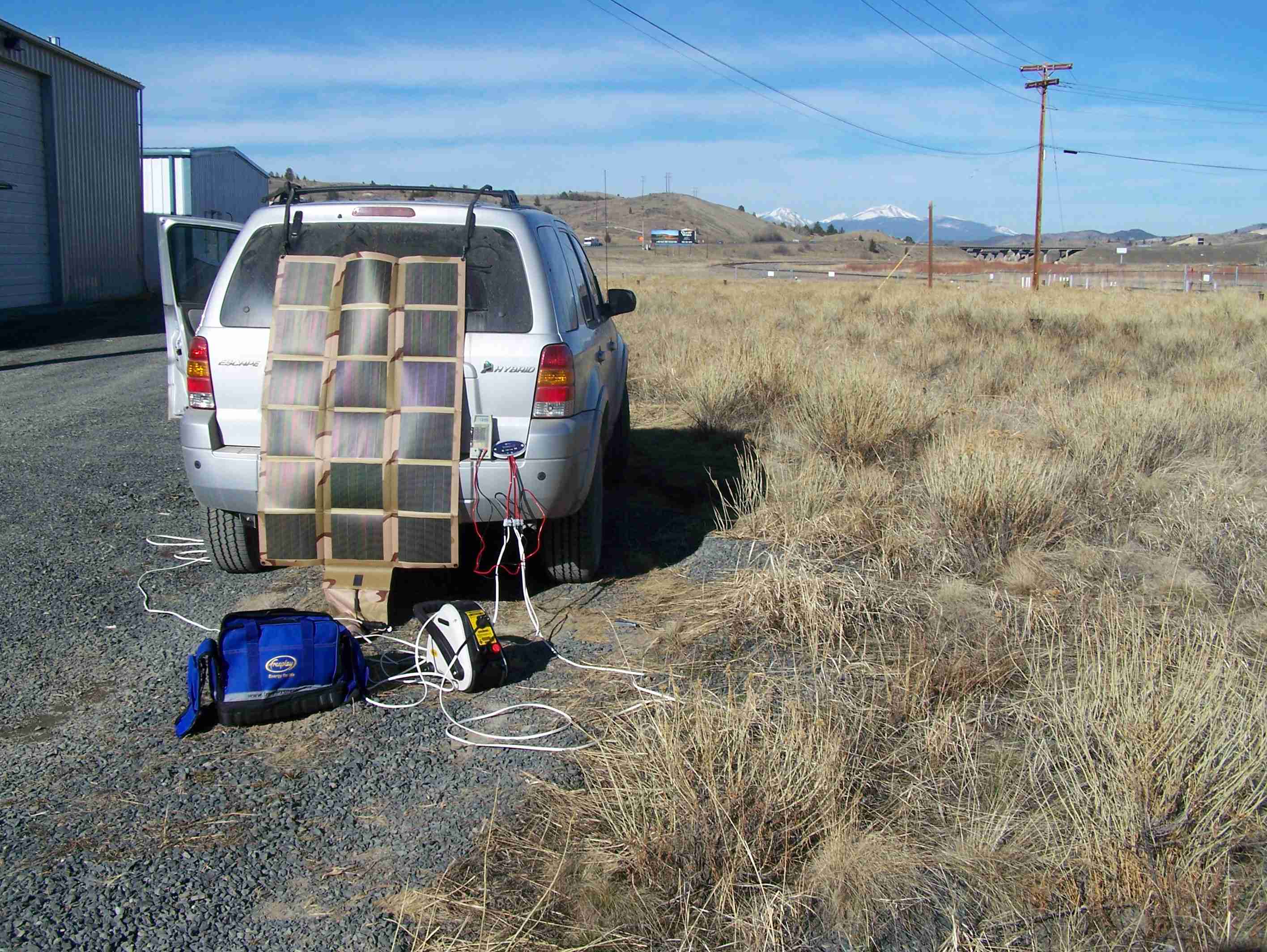 Solar panel and Eco Energy controller on the rear of an SUV